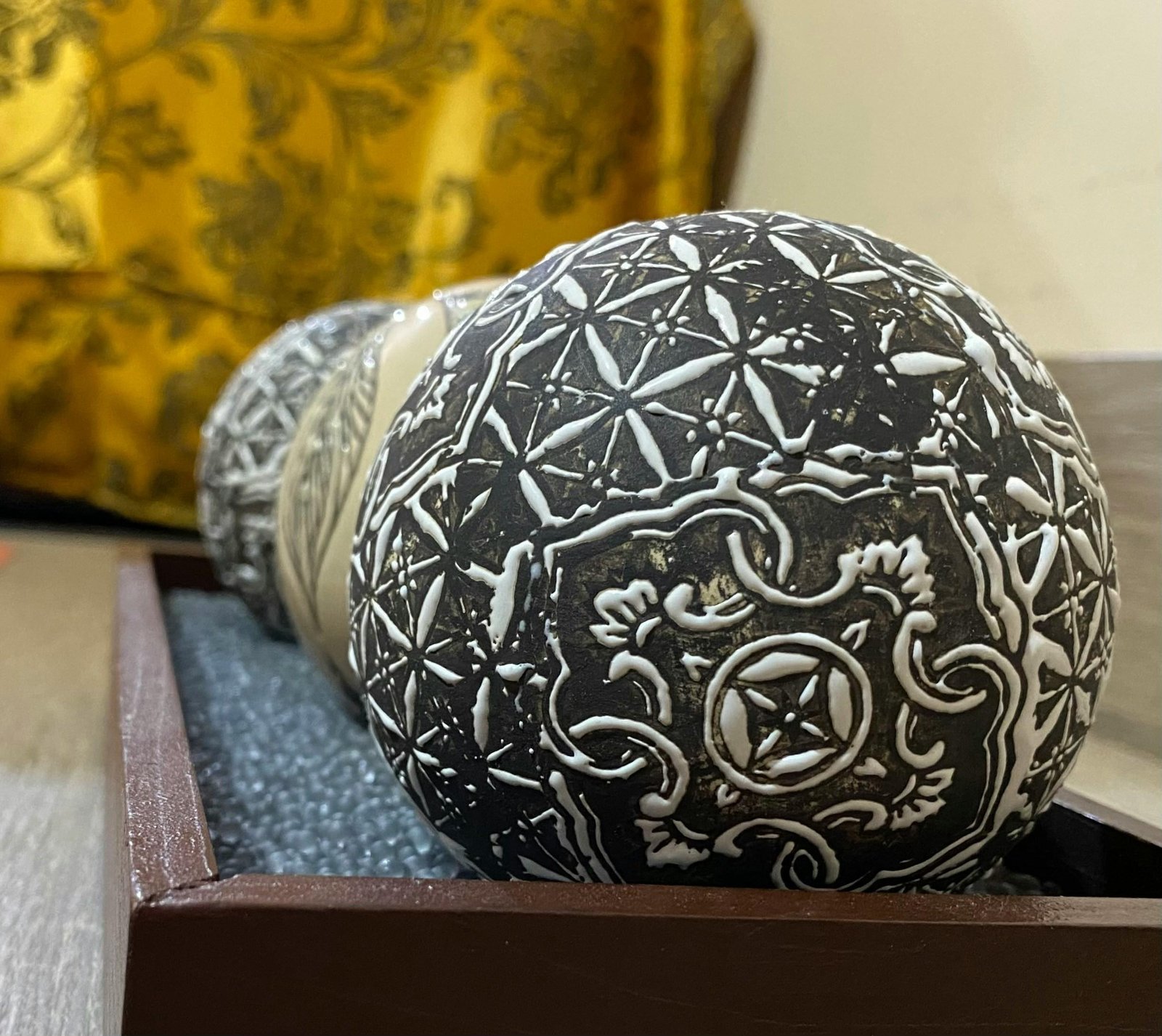 An array of yoga-friendly hair accessories including scrunchies, headbands, and decorative pins displayed on a wooden surface.