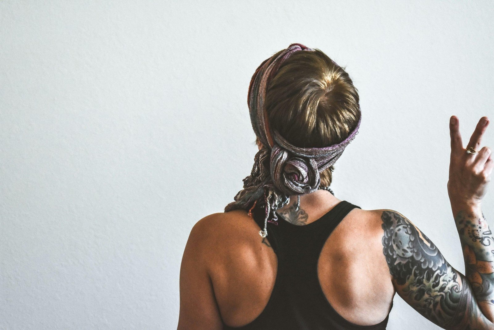 Fitness influencer wearing intricate braided hairstyle during workout