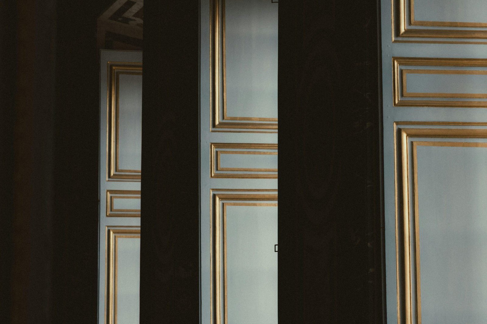 Close-up image showing hands expertly twisting hair into a sleek chignon while securing it with bobby pins.