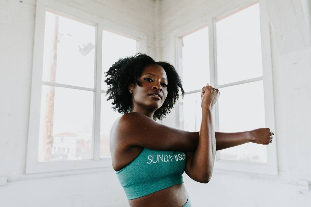 Woman struggling with messy bun during yoga