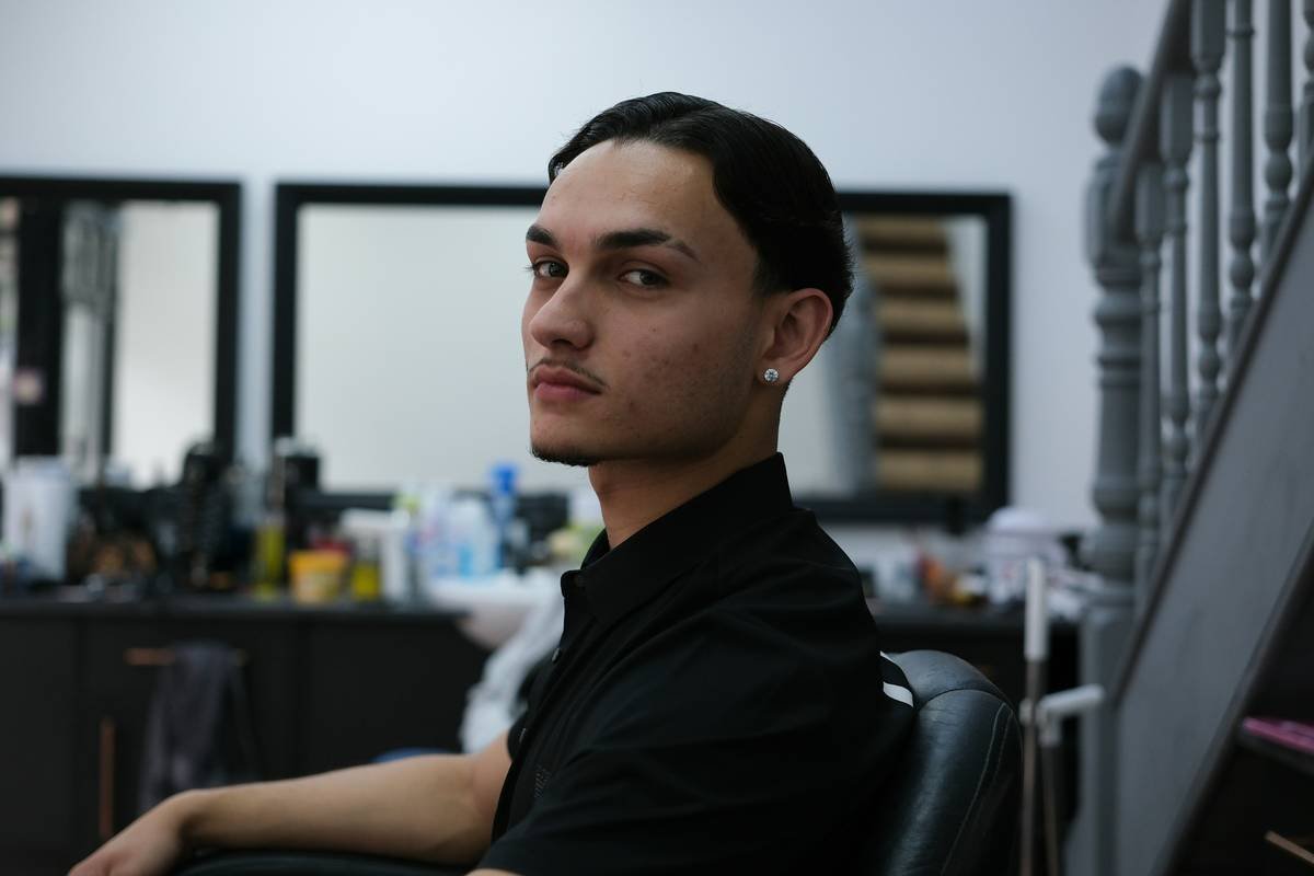 young woman with short blonde bob enjoying music festival in sunny weather