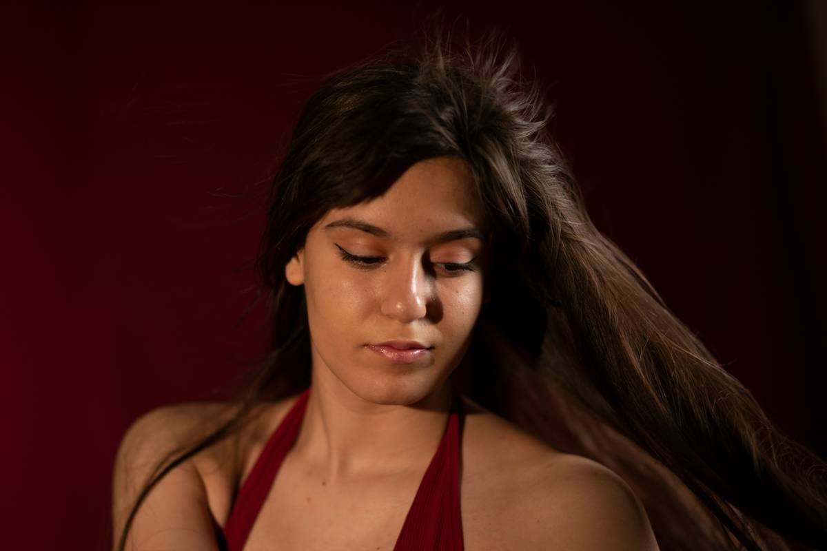 Instructor demonstrating fishtail braid suitable for pilates