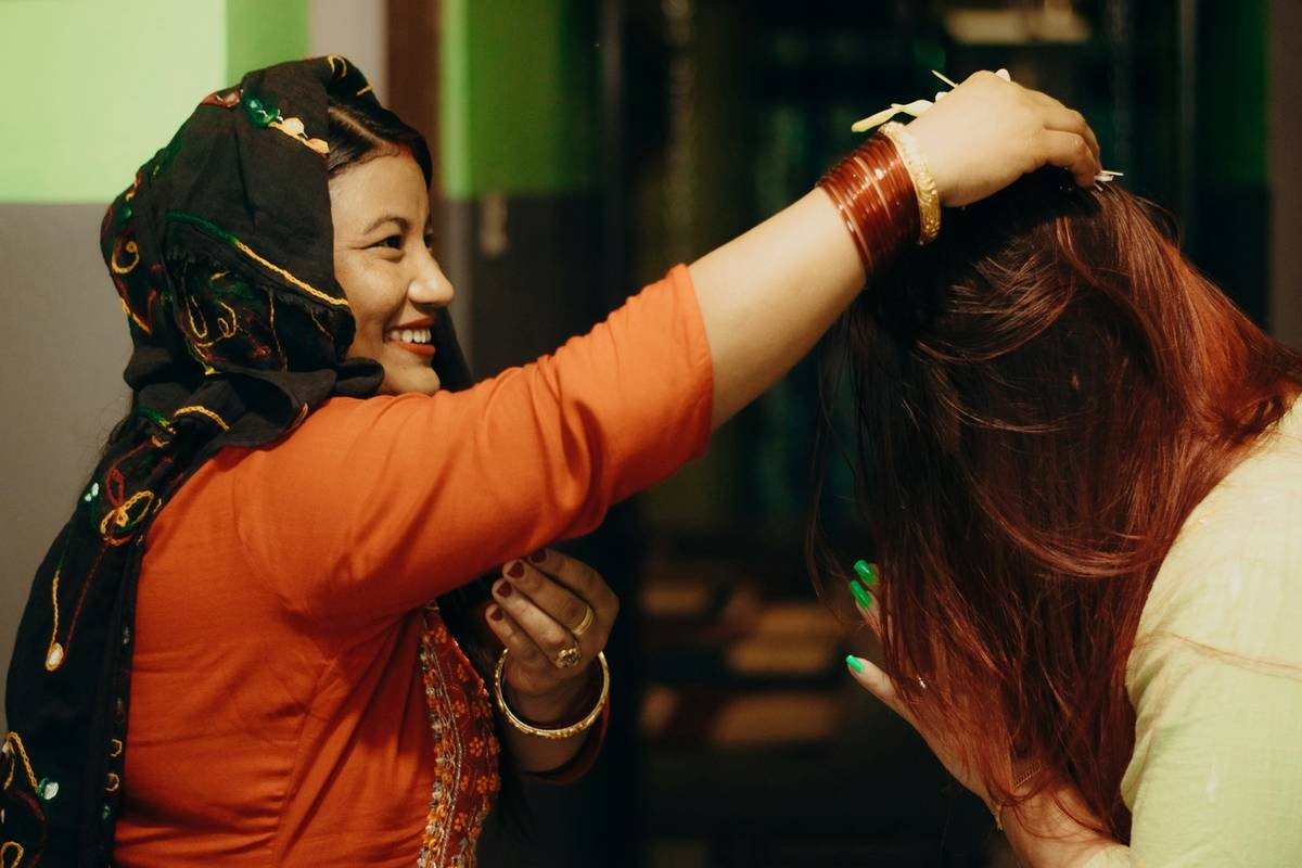 Woman practicing yoga with a braided hairstyle