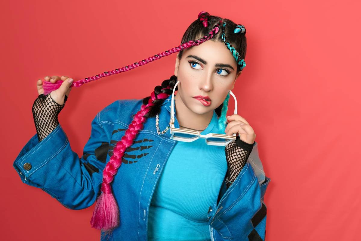 Diagram showing tension points in a traditional vs. flexible braid updo. Traditional shows clustered stress at crown; flexible shows distributed tension along braid path.