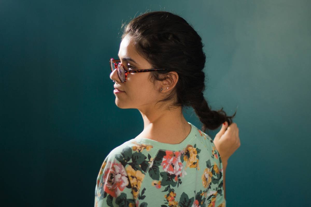 woman in blue and pink floral top