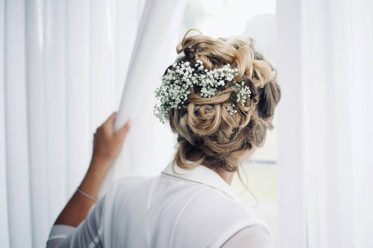 woman standing near window