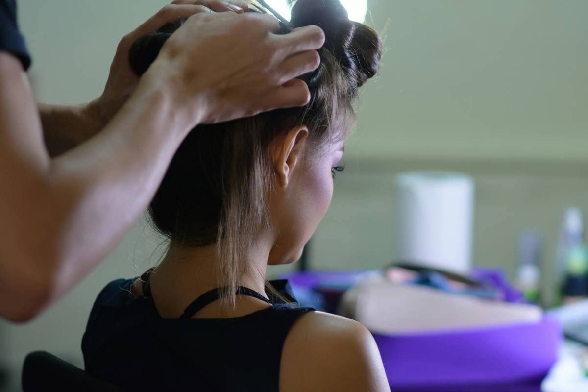Before/after: Woman struggling with slipping ponytail vs. secure athletic hair yoga style using Flow Lock accessories